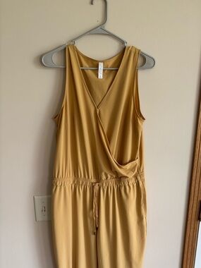 STYLUS Sleeveless Mustard-Gold Surplice Jumpsuit with Drawstring